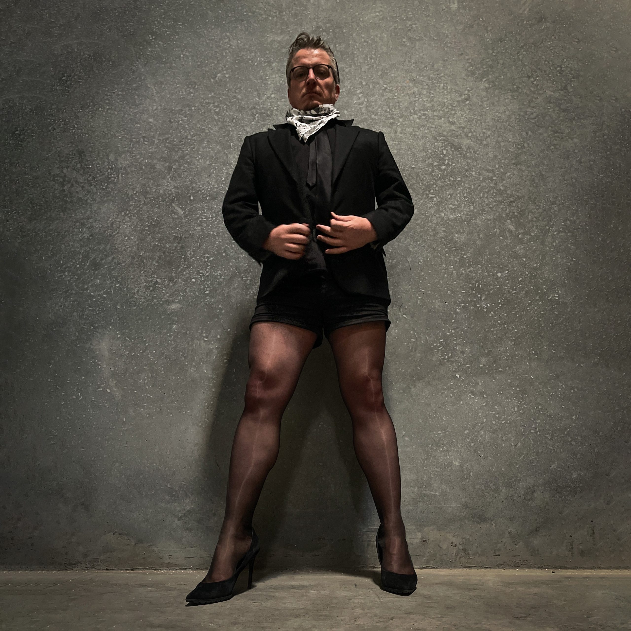 Paul Duane / aka Soul Anarchist, in his signature tailored shorts suit, pantyhose and heels.
